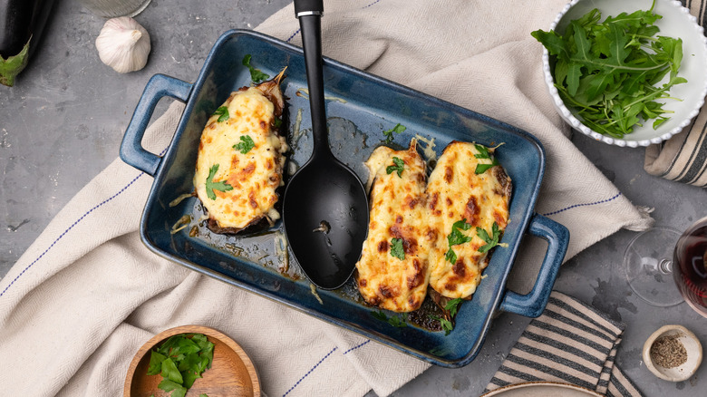 turkey and cheese stuffed eggplants in baking dish