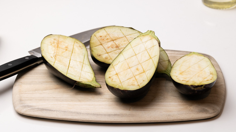 sliced eggplants on chopping board