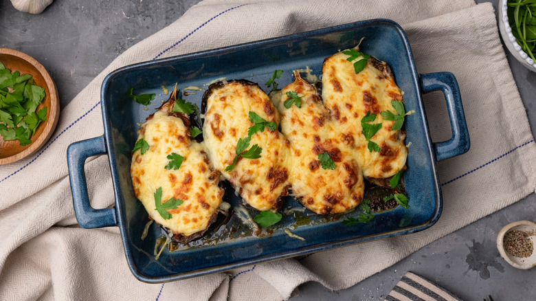 turkey and cheese stuffed eggplants in baking dish