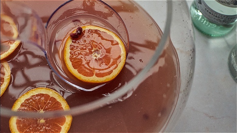 ladling oranges out of bowl