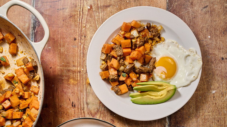 steak hash on plate with egg