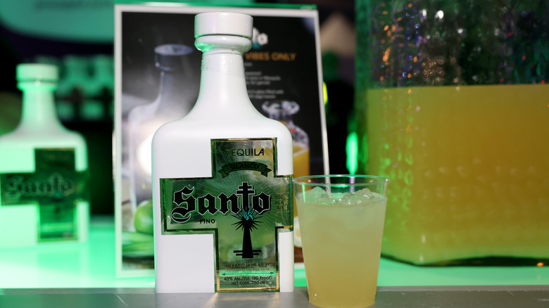 Santo tequila bottle with glass