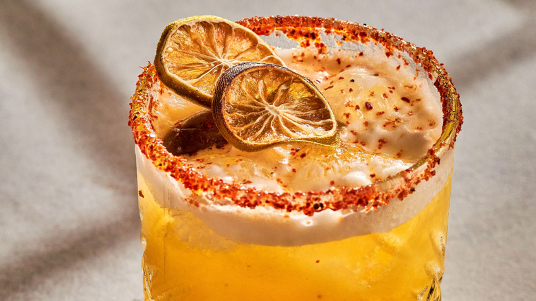 spicy pineapple margarita with a chili rim