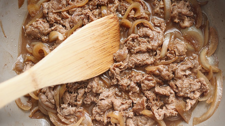 meat and onions in pan