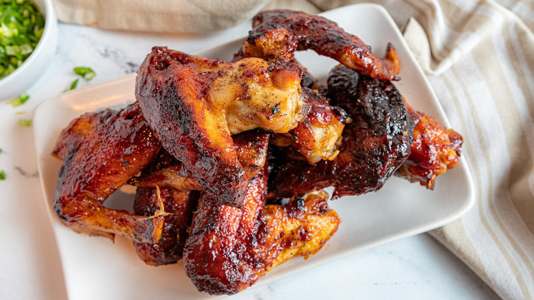 Oven baked wings in a glass baking dish