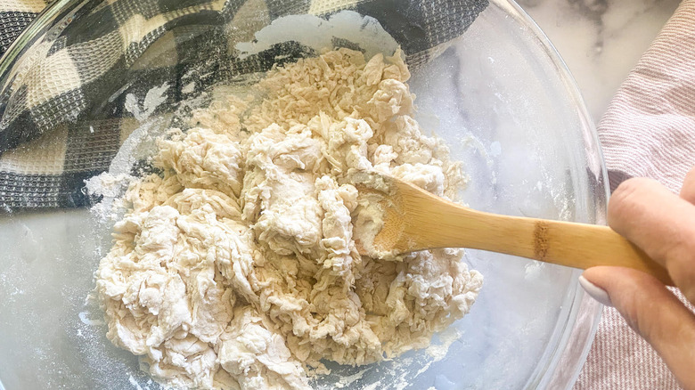 stirring dough in bowl 