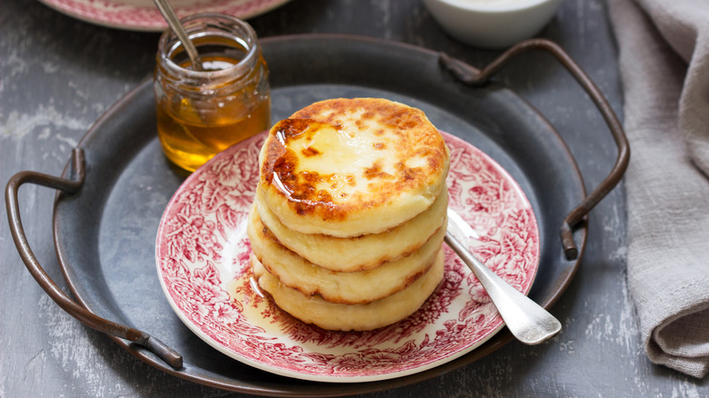 stack of ricotta pancakes with honey