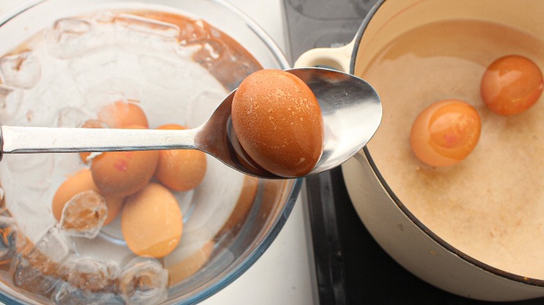 boiled eggs in pot and ice bath