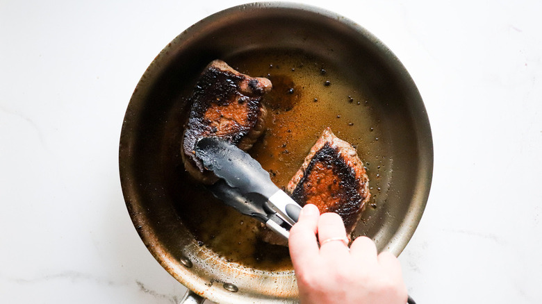 steaks in pan