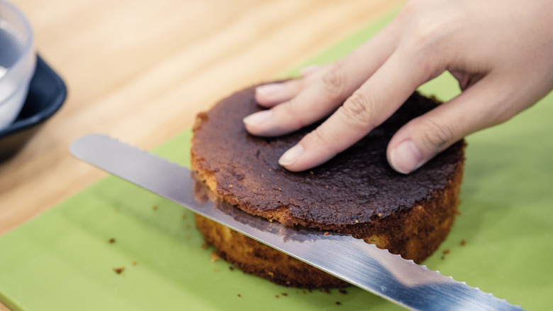 trimming cake with serrated knife