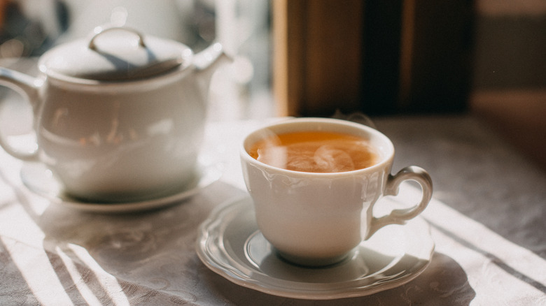 Cup of tea with teapot