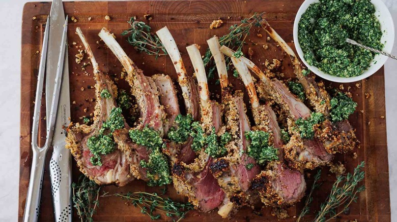 Lamb chops with carving knives on cutting board