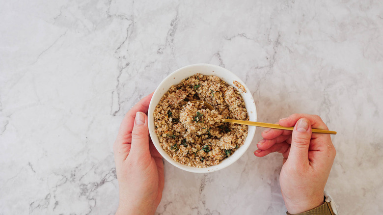 Mixing nuts and garlic in small bowl