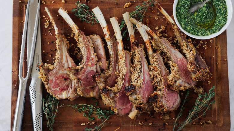 Lamb chops with carving knives on cutting board