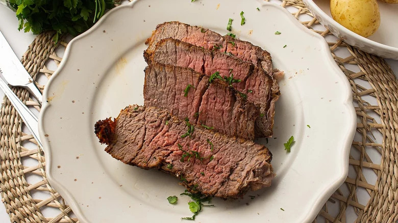 Roast beef on white plate