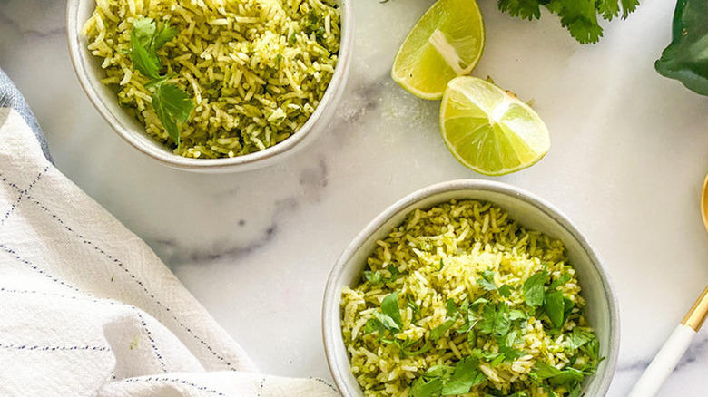 Two bowls of green rice