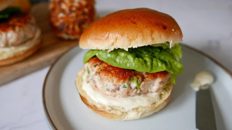 Salmon burger in brioche bun