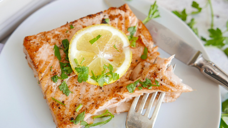 Salmon with lemon slice, parsley