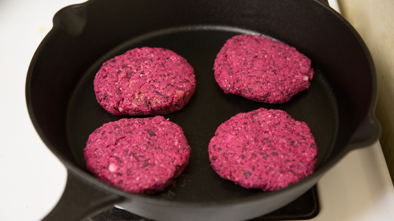 beet burger patties in pan 