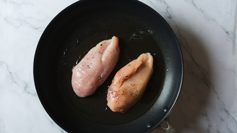 Chicken breasts in pan