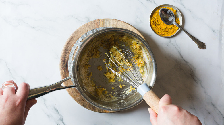 Whisking roux in saucepan