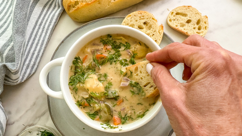 dipping bread in soup