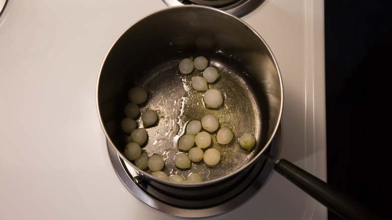 pearl onions cooking in pan 