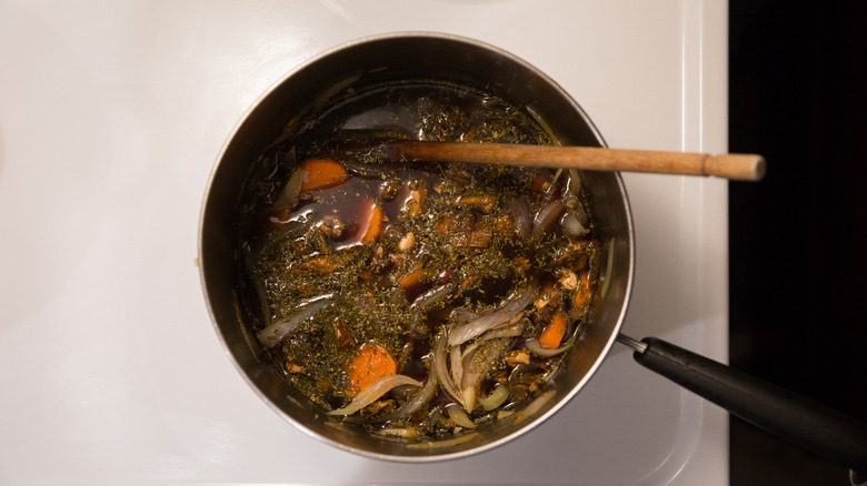 mushroom Bourguignon simmering on stove 