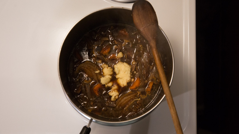 mushroom Bourguignon cooking on stove 