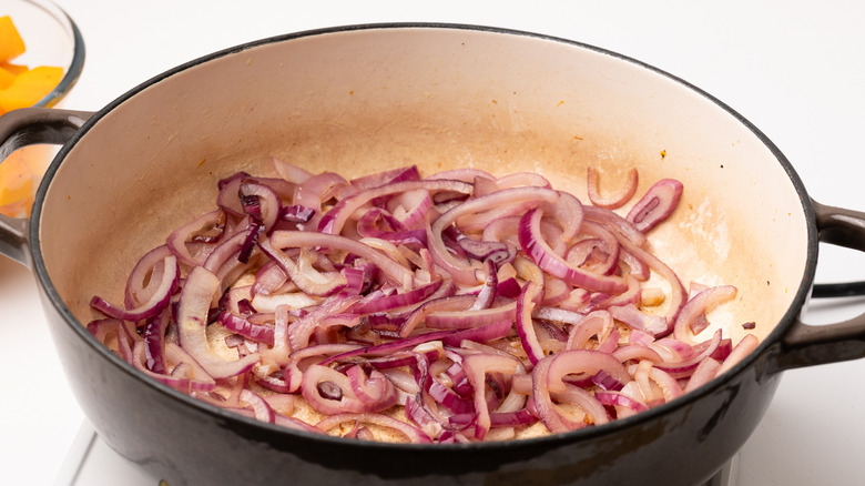 sautéing sliced red onions