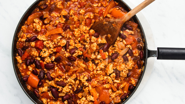 chili in pan with spoon