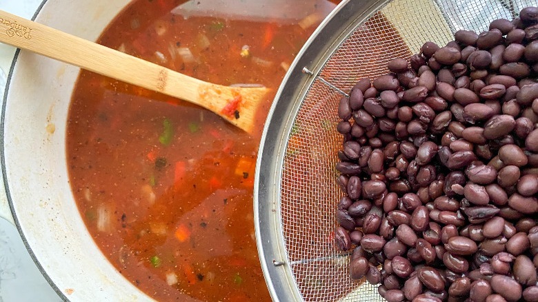 soup and beans in mesh strainer