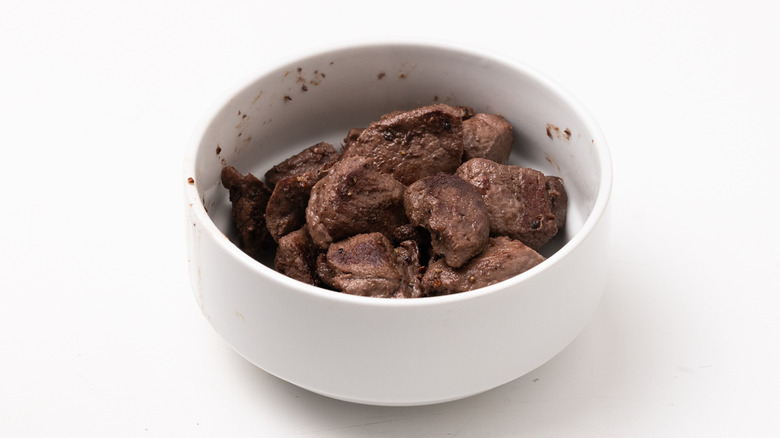 bowl with cooked venison cubes