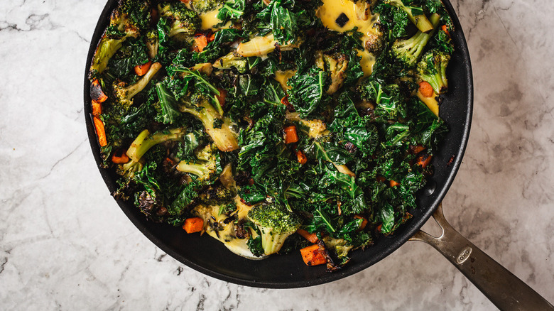 Eggs added to scramble in pan