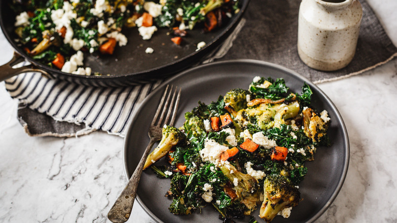 Scramble on plate with pan and olive oil in background