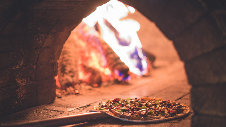 pizza in fire brick oven