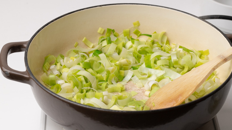 sautéing leeks in a pan