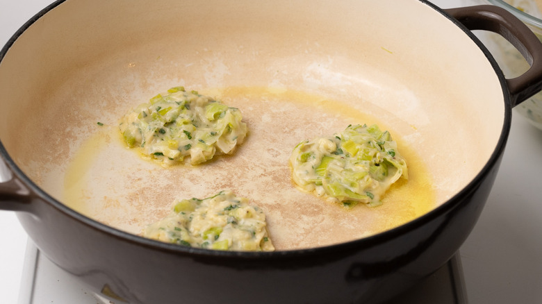 frying herby cheddar leek fritters