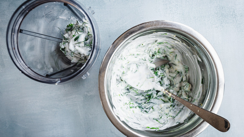 yogurt herb sauce in bowl and blender