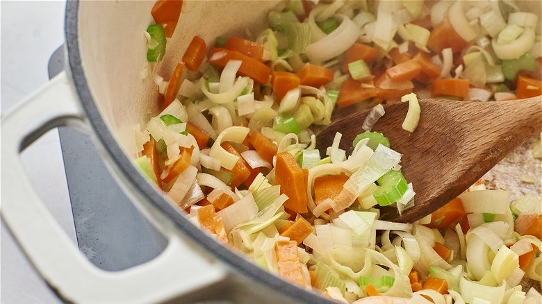 stirring vegetables with a spoon