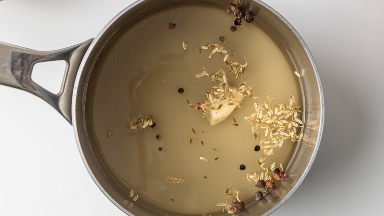 herbs simmering in vinegar