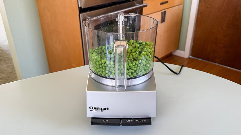 Fresh cooked peas in food processor bowl