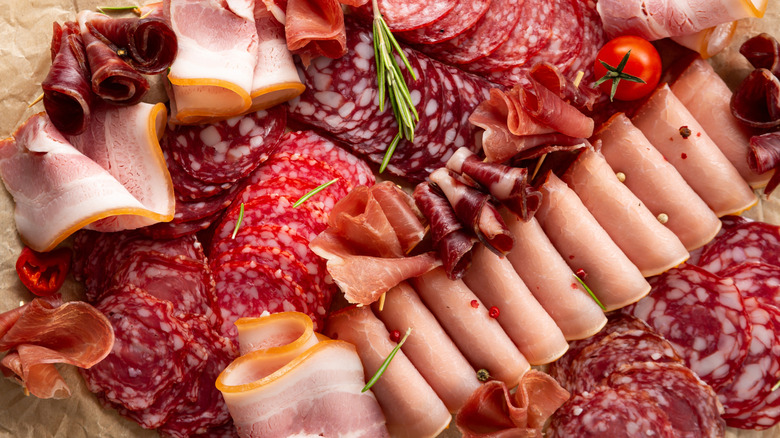 A selection of different deli meats on a platter