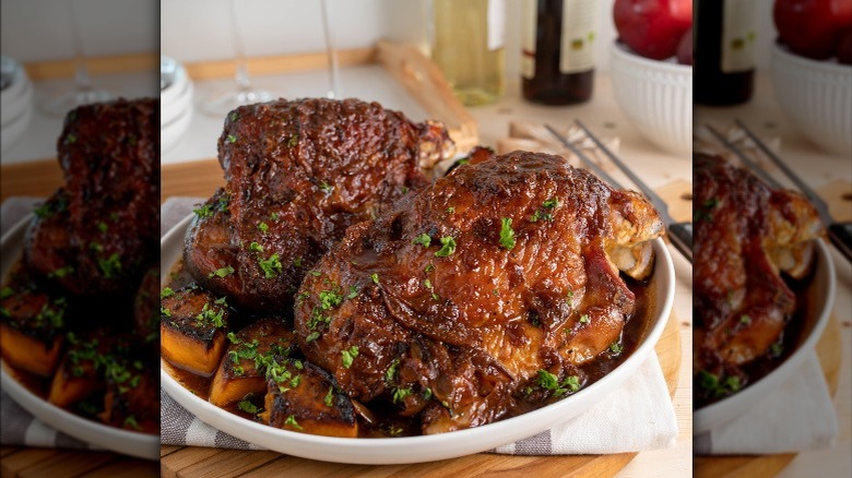 Braised turkey in a bowl with vegetables and sauce