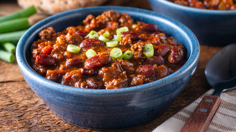 Chili in blue bowl scallions 