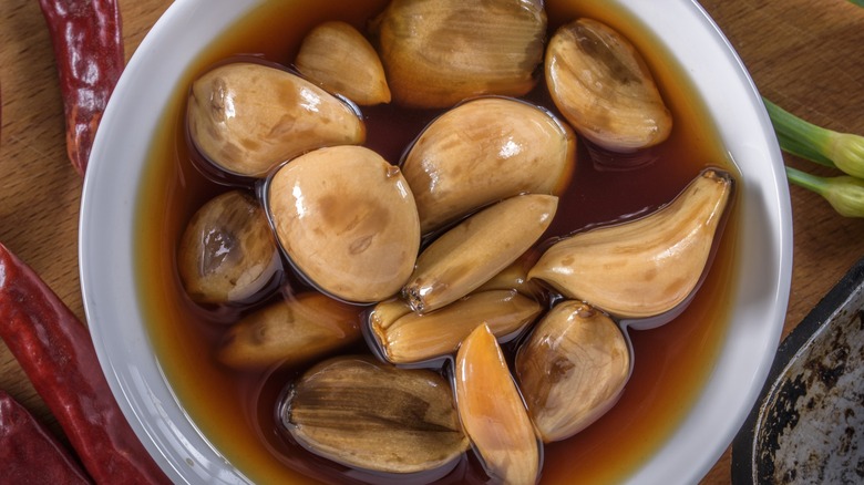 Top-down view of pickled garlic in a bowl