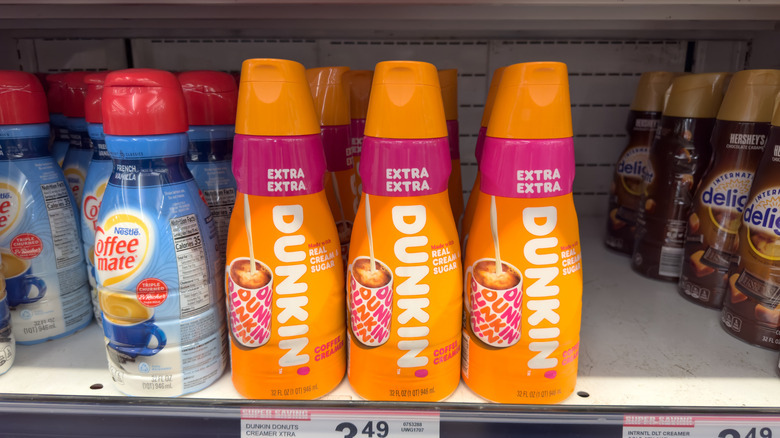 Dunkin' coffee creamer bottles on store shelf