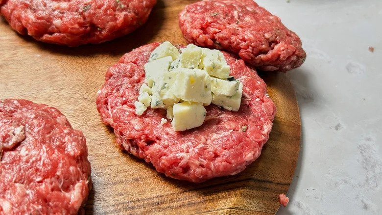 burger patties with blue cheese crumbles