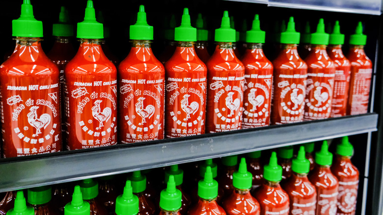 stocked shelf of Sriracha