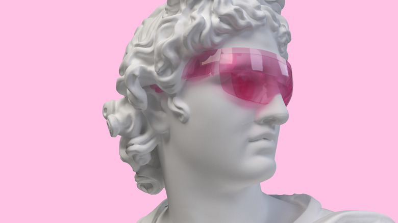 A Greek statue wearing pink glasses.